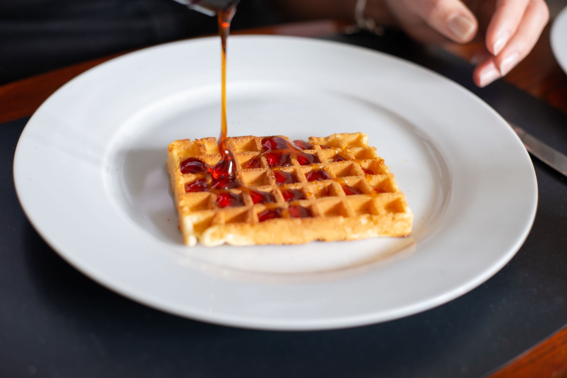 Cheddar-Black Pepper Waffles with Sausage and Apples Maple Agrodolce